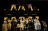 Nicholas Kepros (centre; Emperor Joseph II) welcomes Tim Curry (Mozart) to court. Ian McKellen (Salieri) applauds stage right.