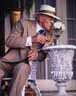 James Whale (Ian McKellen) smells the flowers at George Cukors garden party