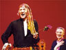 There is an annual Gypsy of the Year competition amongst casts of Broadway shows, organised by Broadway Cares/Equity fights AIDS. This one took place in December 2001 at the Palace Theatre on a Tuesday so everyone could go. Casts devise sketches. For a month before, casts have collected money after their shows, and I announced the winner � and came dressed as a gypsy (pretending I didnt understand that a Broadway gypsy is a chorene.) Thats Marian Seldes behind me.