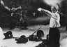 Surrounded by its dead victims, the monster arm stretches out to greet Cuza (Ian McKellen)